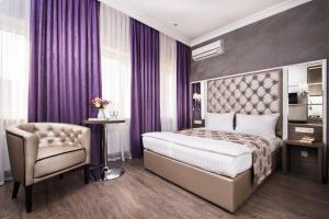 Postel nebo postele na pokoji v ubytování BonApart Hotel by UHM