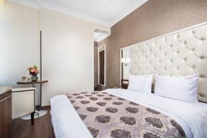 Postel nebo postele na pokoji v ubytování BonApart Hotel by UHM