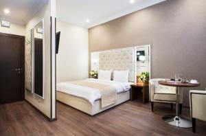 Postel nebo postele na pokoji v ubytování BonApart Hotel by UHM