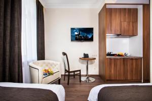TV a/nebo společenská místnost v ubytování BonApart Hotel by UHM