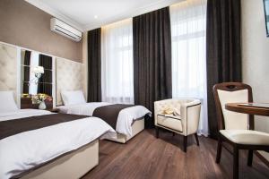 Postel nebo postele na pokoji v ubytování BonApart Hotel by UHM