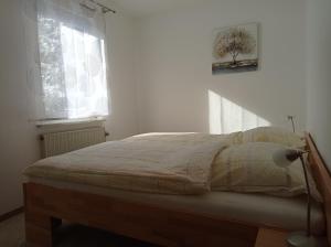 Postel nebo postele na pokoji v ubytování Haus Wald-Eck