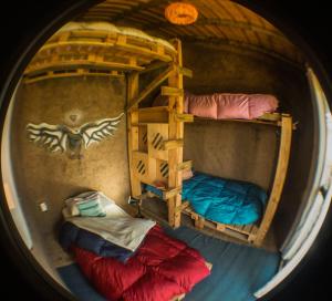 an overhead view of two bunk beds in a room at Lo De Ro in Barra de Valizas
