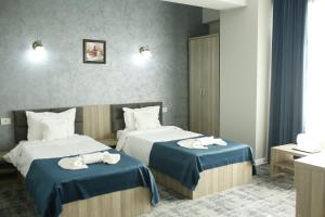 Postel nebo postele na pokoji v ubytování Hotel Agapi Mamaia
