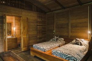 Voodi või voodid majutusasutuse Hamadryade Lodge toas