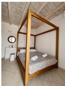 A bed or beds in a room at Natural Stone Villas