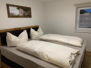 A bed or beds in a room at Schusterbrand Appartements