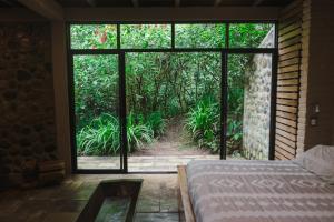 Voodi või voodid majutusasutuse Hamadryade Lodge toas