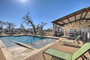 a swimming pool with a slide in it at Chic Tiny Home with Pool Access about 8 Mi to Dtwn! in Austin