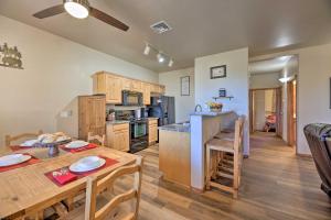 a kitchen and dining room with a table and a dining room at Show Low Condo with Grill, Near Lake and Trails! in Show Low