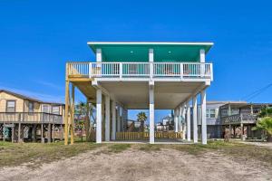 a house with a large deck on top of it at Furnished Deck + Ocean Views: Surfside Beach Home in Surfside Beach