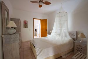 A bed or beds in a room at Adamantea - Le due Lune
