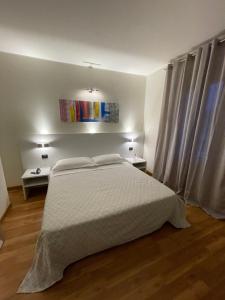 Voodi või voodid majutusasutuse Albergo Ligabue toas