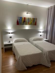 Voodi või voodid majutusasutuse Albergo Ligabue toas