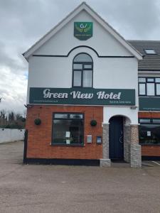 a green view hotel sign on the side of a building at Green View Hotel Near Dartford in Dartford