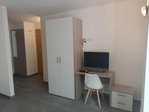 Μια τηλεόραση ή/και κέντρο ψυχαγωγίας στο Gufo Depandance +13 φωτογραφίες