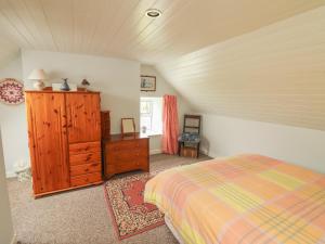 En eller flere senge i et værelse på Limestone Cottage