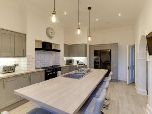 a kitchen with a wooden counter top in a room at Royal Victoria House in Scarborough