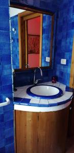 a bathroom with a sink and a mirror at Casa Perni in Buccheri
