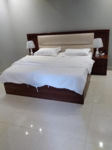 Ένα ή περισσότερα κρεβάτια σε δωμάτιο στο شاليهات خالد