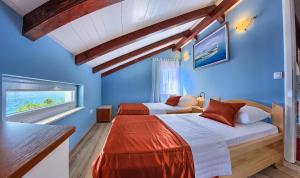 Postel nebo postele na pokoji v ubytování Villa Caljkusic