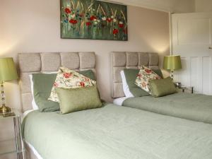 Posteľ alebo postele v izbe v ubytovaní Sunningdale