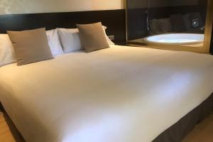 Posteľ alebo postele v izbe v ubytovaní Hotel Punt 14