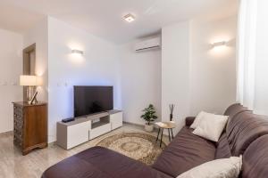 Televízia a/alebo spoločenská miestnosť v ubytovaní Luxury rooftop apartment Zalato