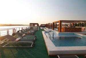 a pool on the deck of a cruise ship at Le Fayan Nile Cruise - Till 17-9 Sat From Luxor for 4&7 Nights Wed From Aswan for 3&7 Nights - 18-9 to 20-11 Thu from Luxor for 4&7 Nights Mon From Aswan for 3&7 Nights - 22-12 Mon from Luxor for 4&7 Nights Fri From Aswan in Luxor