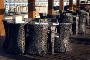a row of tables and chairs in a restaurant at Le Fayan Nile Cruise - Till 17-9 Sat From Luxor for 4&7 Nights Wed From Aswan for 3&7 Nights - 18-9 to 20-11 Thu from Luxor for 4&7 Nights Mon From Aswan for 3&7 Nights - 22-12 Mon from Luxor for 4&7 Nights Fri From Aswan in Luxor