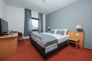 Postel nebo postele na pokoji v ubytování Coffee Fellows Hotel Trier + 37 fotografií