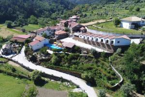 an aerial view of a house on a hill at Mortazel River Houses in Montazel