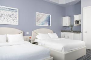 Postel nebo postele na pokoji v ubytování Retro Suites Hotel