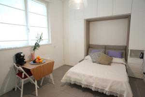 מיטה או מיטות בחדר ב-San Martino House: bright and central!
