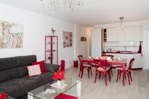 a living room with a couch and a table and chairs at Apartment, Los Llanos de Aridane in Los Llanos de Aridane