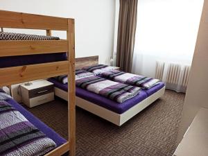 Postel nebo postele na pokoji v ubytování Apartmán Kovářská u Klínovce