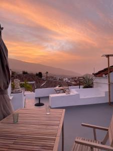 a view from the roof of a building at sunset at Gato Azul - Coliving in La Orotava