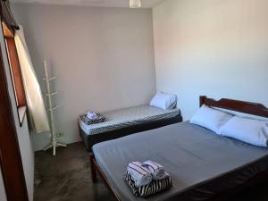 Vila Itanhaém客房内的一张或多张床位