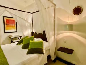 Postel nebo postele na pokoji v ubytování Mangueira Boutique Hotel Moreré