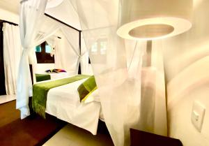 Postel nebo postele na pokoji v ubytování Mangueira Boutique Hotel Moreré