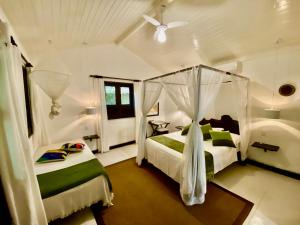 Postel nebo postele na pokoji v ubytování Mangueira Boutique Hotel Moreré