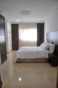 Llit o llits en una habitació de HOTEL BEAUTIFUL