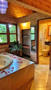 a large bathroom with a tub and a shower at Finca Turística de Alojamiento Rural Avalon in Jardin +75 photos