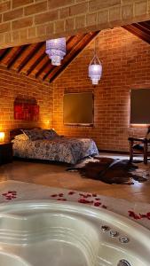A bed or beds in a room at Avalon Hotel Campestre