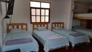 Een bed of bedden in een kamer bij Hotel Duna Sur