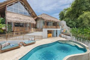 an image of a house with a swimming pool at Arkana Village Canggu by Nagisa Bali in Canggu