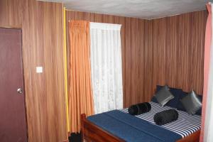 Giường trong phòng chung tại Bezel Bungalow Nuwara Eliya