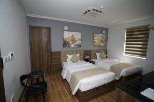 Cama ou camas em um quarto em Minh Phát Hotel