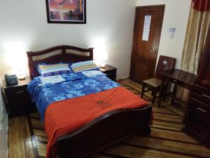 Postel nebo postele na pokoji v ubytování HOTEL VELANEZ SUITE Riobamba