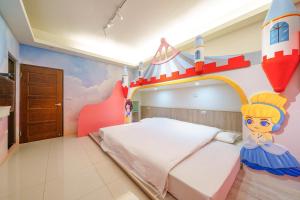 Ein Bett oder Betten in einem Zimmer der Unterkunft Jinduo Family Homestay